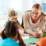 happy-teacher-listening-her-students